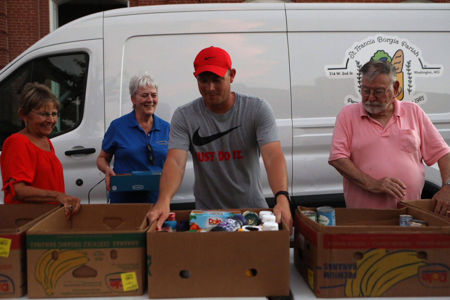 Volunteers collect food donations